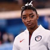 Simone Biles waits for the final results of the artistic gymnastics women’s team final during the Tokyo 2020 Olympic Games (Photo by LOIC VENANCE/AFP via Getty Images)