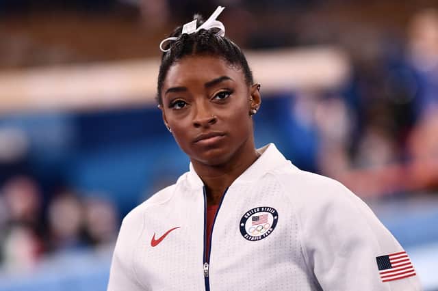 Simone Biles waits for the final results of the artistic gymnastics women’s team final during the Tokyo 2020 Olympic Games (Photo by LOIC VENANCE/AFP via Getty Images)