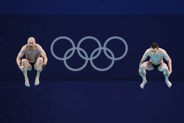 Evgenii Kuznetsov and Nikita Shleikher of Team Russian Olympic Committee compete during the Men’s Synchronised 3m Springboard final on day five of the Tokyo 2020 Olympic Games (Photo by Maddie Meyer/Getty Images)
