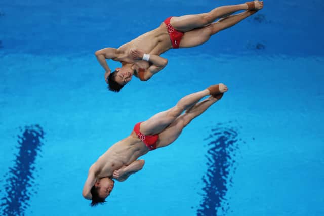 Zongyuan Wang and Siyi Xie of Team China compete during the Men's Synchronised 3m Springboard final on day five of the Tokyo 2020 Olympic Games at Tokyo Aquatics Centre on July 28, 2021 in Tokyo, Japan. (Photo by Tom Pennington/Getty Images)
