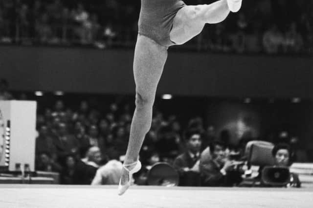 Soviet gymnast Larissa Latynina in action during the women’s compulsory exercises at the Tokyo Olympics, October 1964. (Photo by Hulton Archive/Getty Images)  