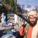 A Taliban fighter holds a rocket-propelled grenade (RPG) along the roadside in Herat, Afghanistan’s third biggest city (Photo by -/AFP via Getty Images)