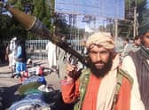 A Taliban fighter holds a rocket-propelled grenade (RPG) along the roadside in Herat, Afghanistan’s third biggest city (Photo by -/AFP via Getty Images)