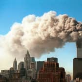 Smoke pours from the World Trade Center after it was hit by two hijacjked passenger planes September 11, 2001  (Photo by Robert Giroux/Getty Images)