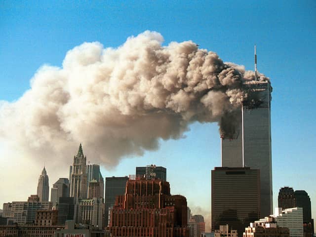 Smoke pours from the World Trade Center after it was hit by two hijacjked passenger planes September 11, 2001  (Photo by Robert Giroux/Getty Images)