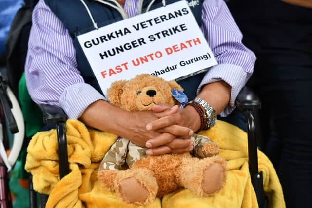 Support Our Gurkhas protester Dhan Gurung holds a teddy bear as he continues a hunger strike during a demonstration for equal pensions outside Downing Street (Photo: JUSTIN TALLIS/AFP via Getty Images)