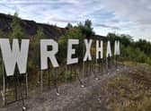 Giant white letters spell out Wrexham just outside of the town (Photo: Twitter/@Wrexham_AFC)