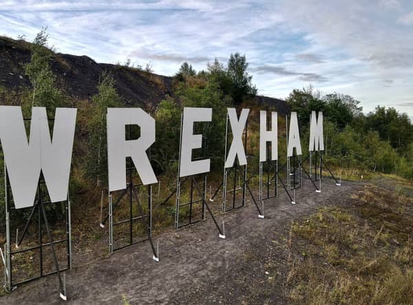 Giant white letters spell out Wrexham just outside of the town (Photo: Twitter/@Wrexham_AFC)