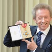 Former Scotland and Manchester United footballer Denis Law poses with his Commander of the Order of the British Empire (CBE) medal that was presented to him by the Duke of Cambridge during an Investiture ceremony at Buckingham Palace on March 11, 2016 in London, United Kingdom. (Pic: Getty)