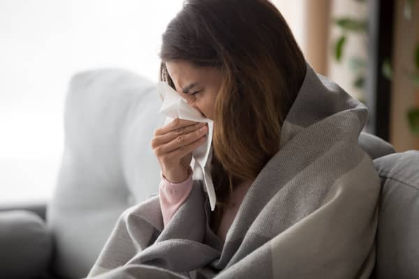 Scientists at the ZOE Symptom Study App have said their data shows sneezing and having a runny nose are common Covid symptoms (image: Shutterstock)