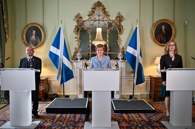 <p>First Minister Nicola Sturgeon (centre) and Scottish Green Party co-leaders Patrick Harvie (left) and Lorna Slater (right) at Bute House (Photo: PA)</p>