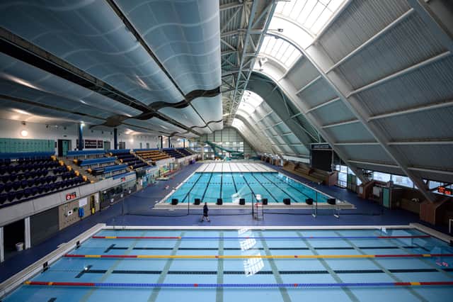 <p>The main swimming pool hall of the Manchester Aquatics Centre (Photo by OLI SCARFF/AFP via Getty Images)</p>