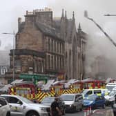 Picture taken with permission from the Twitter feed of Matt Donlan of firefighters at the scene of a large fire at George IV Bridge in Edinburgh