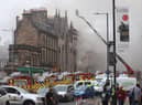 Picture taken with permission from the Twitter feed of Matt Donlan of firefighters at the scene of a large fire at George IV Bridge in Edinburgh