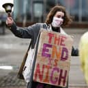 Activists hold a demonstration marking the date of the delayed Cop26 UN climate negotiations on 13 November 2020 in Glasgow (Photo: Jeff J Mitchell/Getty Images)