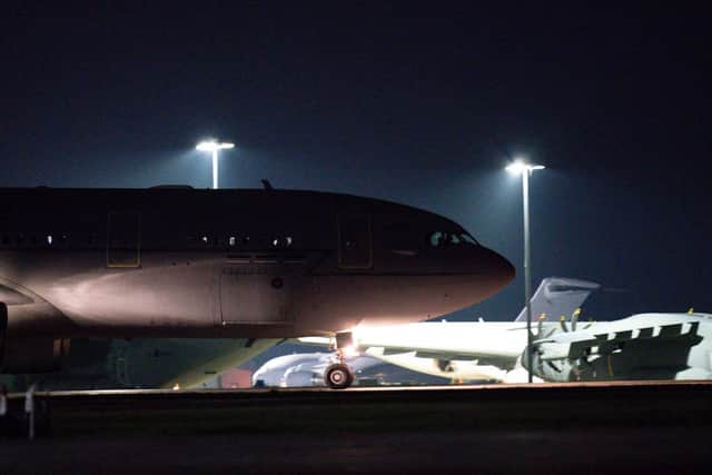 A British military transport aircraft flying passengers evacuated from Afghanistan lands at RAF Brize Norton (Photo: JACOB KING/POOL/AFP via Getty Images)