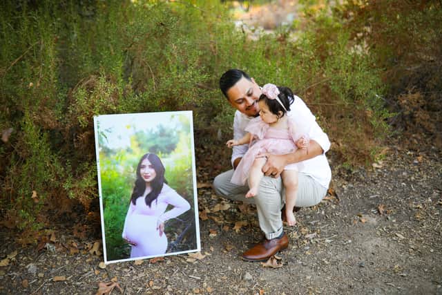 James and Adalyn with Yesenia’s photo (Grisel Leyva X&V Photography / SWNS)