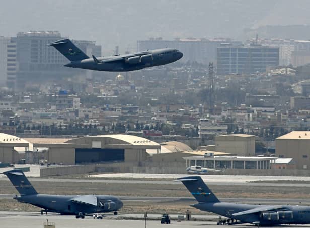 <p>A US Air Force aircraft takes off from the airport in Kabul on August 30 as rockets were fired at the airport where US troops were racing to complete their withdrawal (Aamir Qureshi / AFP/Getty)</p>