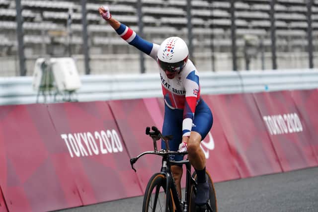 Dame Sarah Storey punches the air as she finishes claims victory in the C5 time trial in Tokyo . (Pic: Getty)