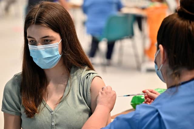 Teenager Katie Moore receives a Covid-19 vaccination in Barrhead, Scotland (Photo: Jeff J Mitchell/Getty Images)