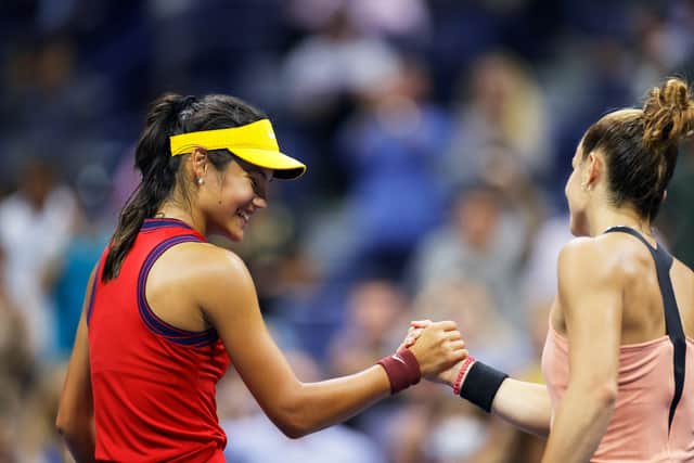 Emma Raducanu of Great Britain shakes hands with Maria Sakkari of Greece after winning their semi-final match