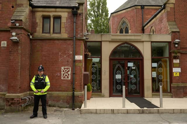 Police officers stand on duty outside a Didsbury Mosque in Didsbury, Manchester (Getty Images)