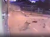 One of the brothers, in a Range Rover Evoque, slows as he reaches the roundabout and the scene of the smash