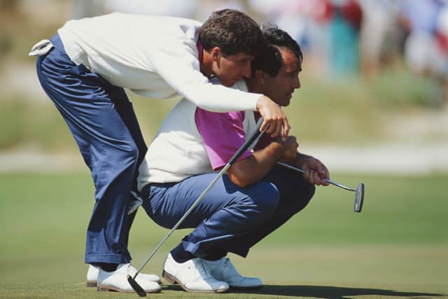 Jose-Maria Olazabal of Spain uses the shoulders of Seve Ballesteros also of Spain to get a better view of the hole during the 29th Ryder Cup 
