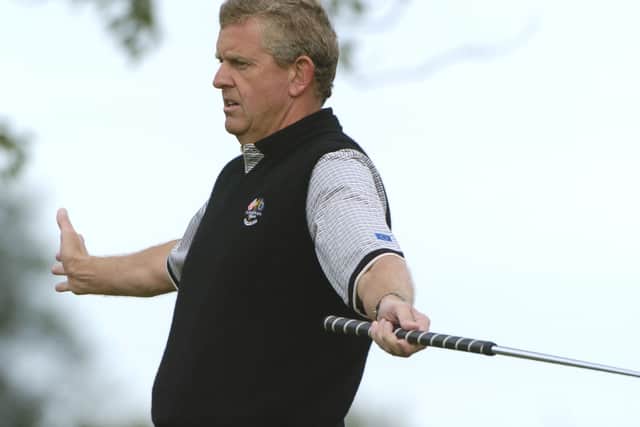 Colin Montgomerie watches a birdie  putt  fall during  four-ball competition at the 2004 Ryder Cup in Detroit