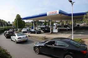 A line of vehicles queue to fill up at a Tesco petrol station in Camberley, west London, (image: Adrian Dennis/AFP via Getty Images)