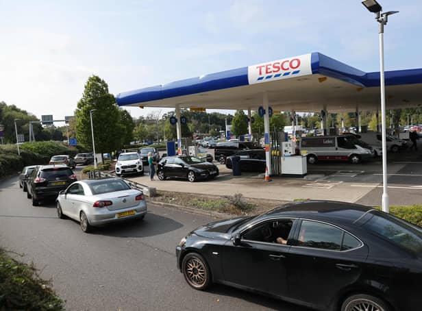 <p>A line of vehicles queue to fill up at a Tesco petrol station in Camberley, west London, (image: Adrian Dennis/AFP via Getty Images)</p>
