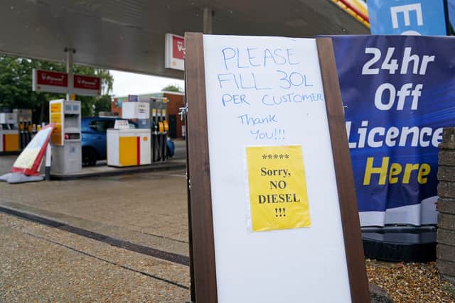 A sign asking customers to only fill 30 litres of fuel and that no diesel is available outside a Shell petrol station in Aldershot, Hampshire (image: PA)