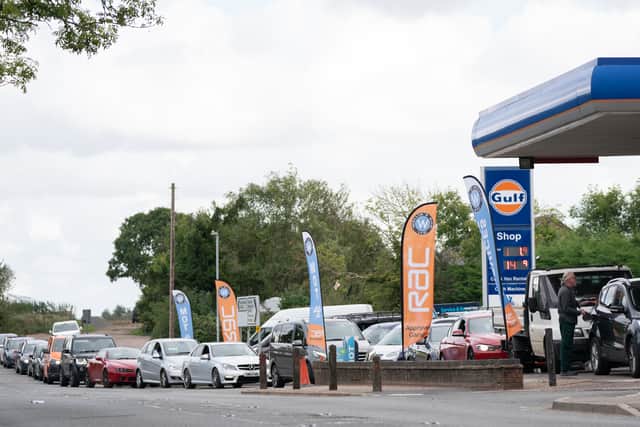 People queue for fuel at a petrol station in Barton, Cambridgeshire on September 28 (image: PA)