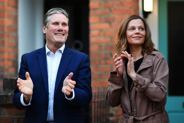 Labour leader Sir Keir Starmer and his wife Victoria pictured applauding for key workers outside their home last year in London (image: Getty)