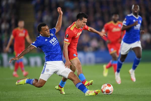 Hirving Lozano of SSC Napoli is challenged by Ryan Bertrand of Leicester City during the UEFA Europa League group C match between Leicester City and SSC Napoli at The King Power Stadium on September