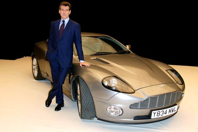 Actor Pierce Brosnan poses for photographers January 11, 2002 during the press launch of the new James Bond movie (Photo by Anthony Harvey/Getty Images)