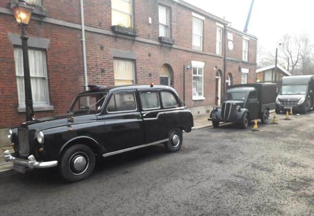 1960s vinitage cars were parked in Bolton in November 2020 as Ridley Road filmed in streets around the city (Picture: Bolton News)