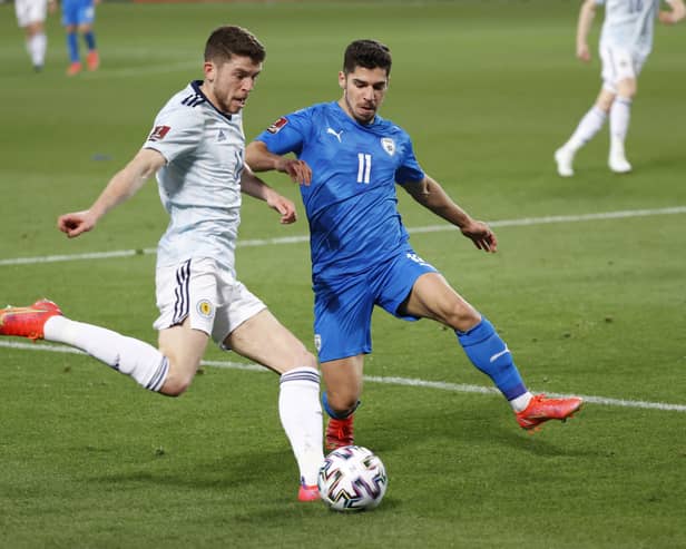 Scotland’s midfielder Ryan Christie tries to cross as he is marked by Israel’s midfielder Manor Solomon during the 2022 FIFA World Cup qualifier group F football match between Israel and Scotland at Bloomfield stadium in the Israeli Mediterranean coastal city of Tel Aviv