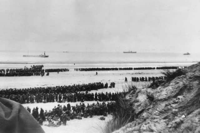 May 1940:  British Expeditionary Forces and French troops awaiting evacuation from the beach at Dunkirk.  (Photo by Topical Press Agency/Getty Images)