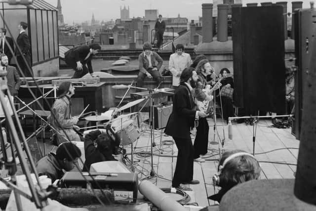 The Beatles performing their last live public concert on the rooftop of the Apple Organization in London in 1969 (Photo by Evening Standard/Hulton Archive/Getty Images)