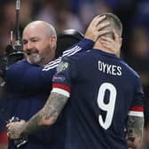Steve Clarke, manager of Scotland interacts with Lyndon Dykes after the 2022 FIFA World Cup Qualifier match between Scotland and Israel at Hampden Park on October 09, 2021