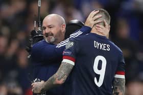 Steve Clarke, manager of Scotland interacts with Lyndon Dykes after the 2022 FIFA World Cup Qualifier match between Scotland and Israel at Hampden Park on October 09, 2021