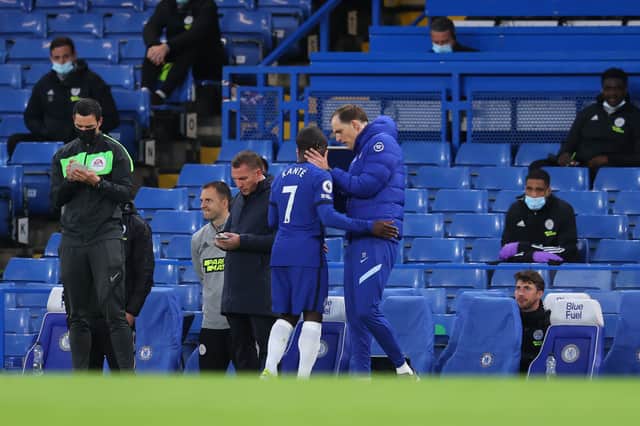 <p>N’Golo Kante of Chelsea is consoled by Thomas Tuchel, Manager of Chelsea as he is substituted  (Photo by Catherine Ivill/Getty Images)</p>
