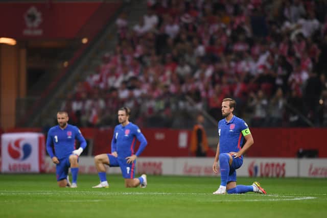 England players taking the knee. Hungary fans hurled racial abuse at England players in September.
