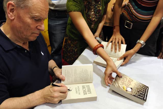 Jeffrey Archer signing books during an interaction with readers at a book signing session in Mumbai (Photo: INDRANIL MUKHERJEE/AFP via Getty Images)