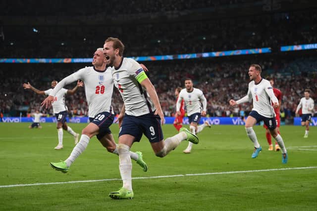 Harry Kane is congratulated by Phil Foden after scoring the second goal during the UEFA Euro 2020 Championship Semi-final match between England and Denmark at Wembley Stadium on July 7 (image: Getty)