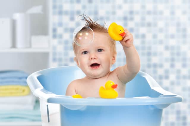 Bath, sensory and wooden toys to help develop cognitive and fine motor skills for your baby