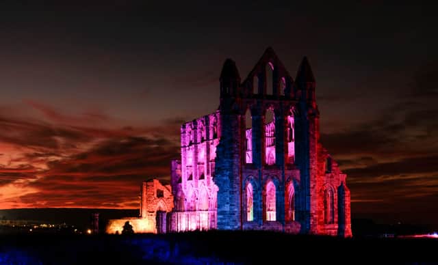 A light display illuminates the historic Whitby Abbey, which is famously noted for being the inspiration behind Bram Stoker’s Dracula (Photo: Ian Forsyth/Getty Images)