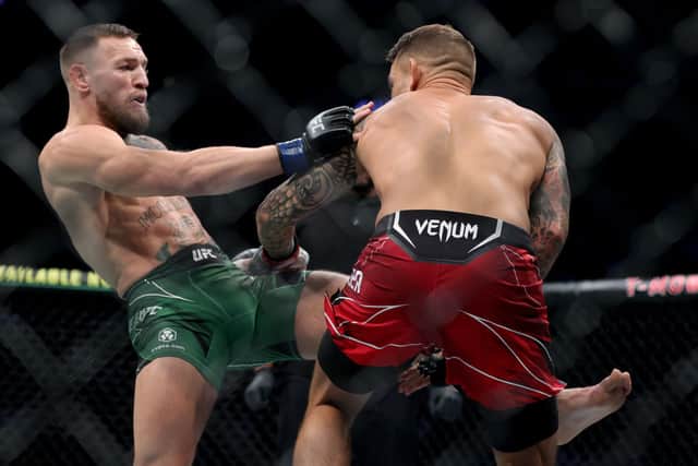 Conor McGregor attempts a kick against Dustin Poirier in the first round in their lightweight bout (Photo: Stacy Revere/Getty Images)
