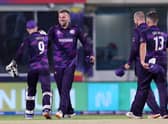 Scotland's players celebrate their win in the ICC mens Twenty20 World Cup cricket match between Bangladesh and Scotland at the Oman Cricket Academy Ground in Muscat